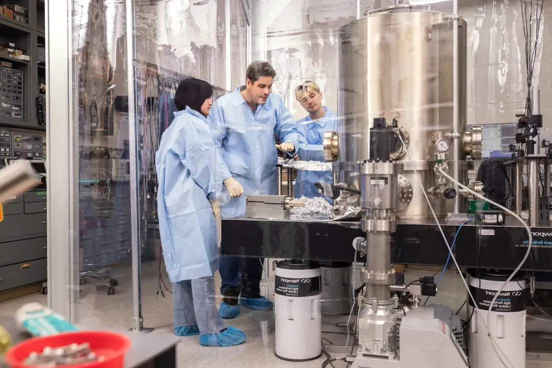 Student working on a gravitational waves research project in a laboratory.